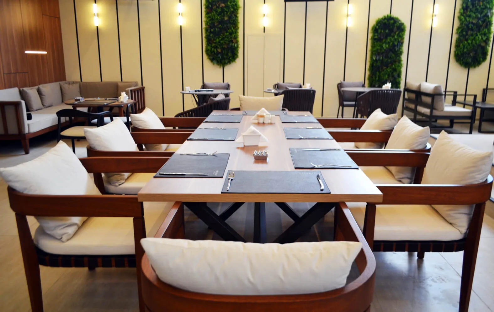Long dining table and seating areas in the restaurant