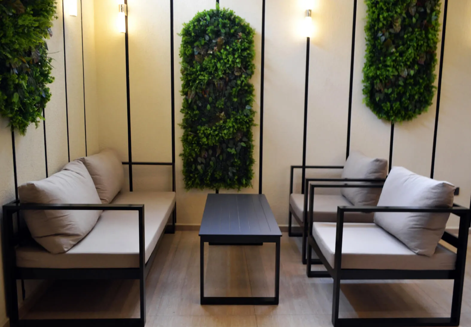 Seating group in front of a plant wall in the restaurant