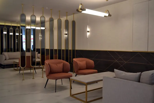 Lobby seating area separated by mirrored panels