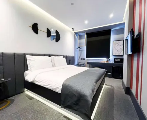 Bed, television and study desk in the Family Room