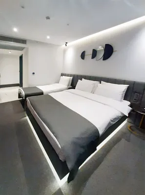 Bed with under-bed lighting in the Standard Room