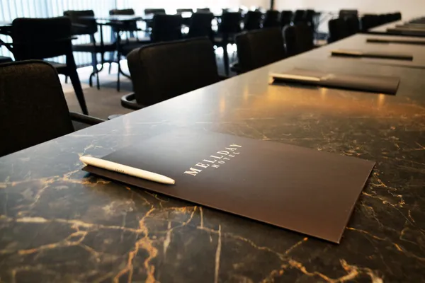 Mellday Hotel folder on the Large Meeting Room table